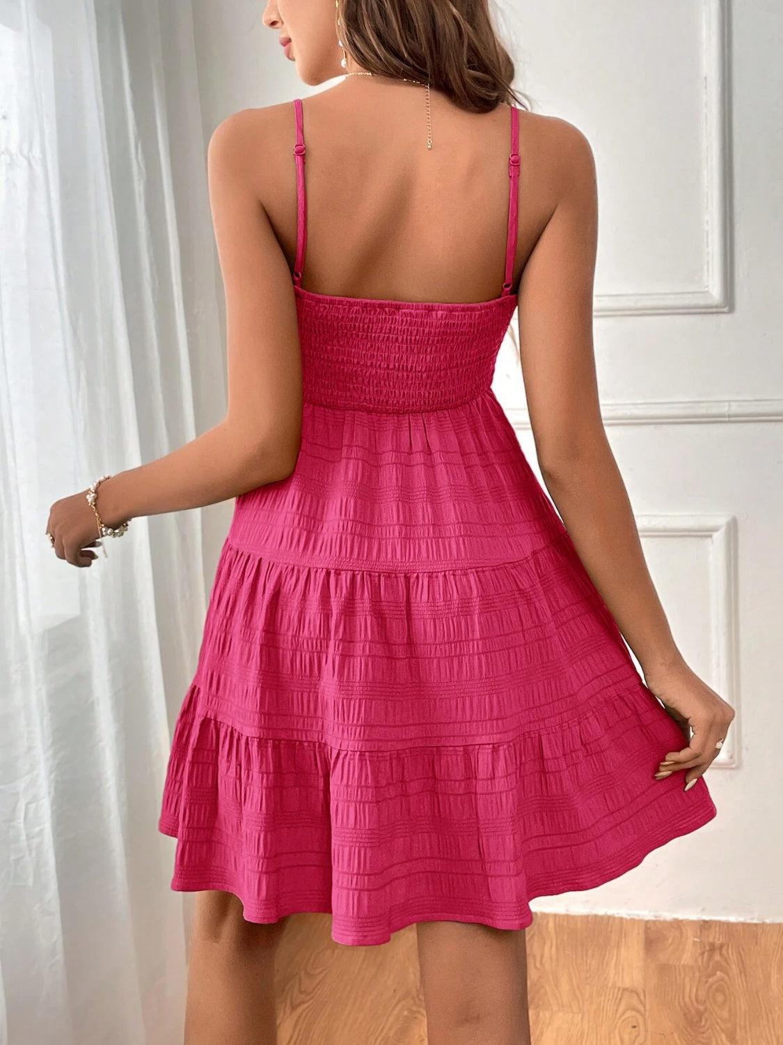 a woman in a pink dress looking back