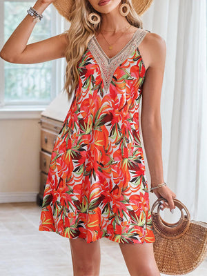 a woman in a red dress and straw hat