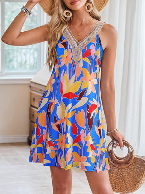 a beautiful woman in a colorful dress and straw hat