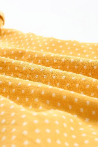 a close up of a yellow polka dot fabric