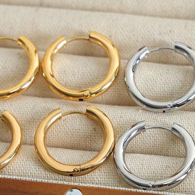 four pairs of gold and silver hoop earrings