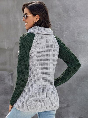 a woman wearing a green and white sweater