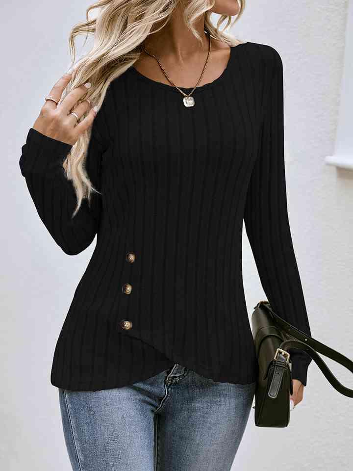 a woman wearing a black sweater and jeans