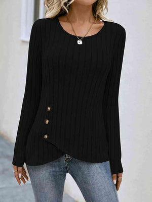 a woman wearing a black sweater and jeans