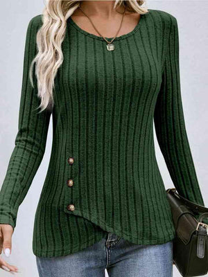 a woman wearing a green sweater and jeans