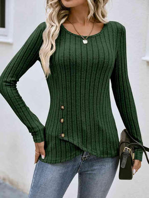 a woman wearing a green sweater and jeans