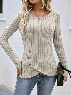 a woman wearing a sweater and jeans