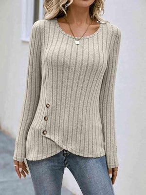 a woman wearing a sweater and jeans