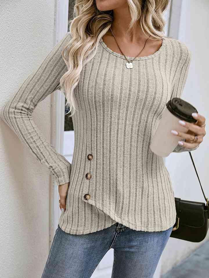 a woman wearing a sweater and jeans