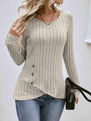 a woman wearing a sweater and jeans