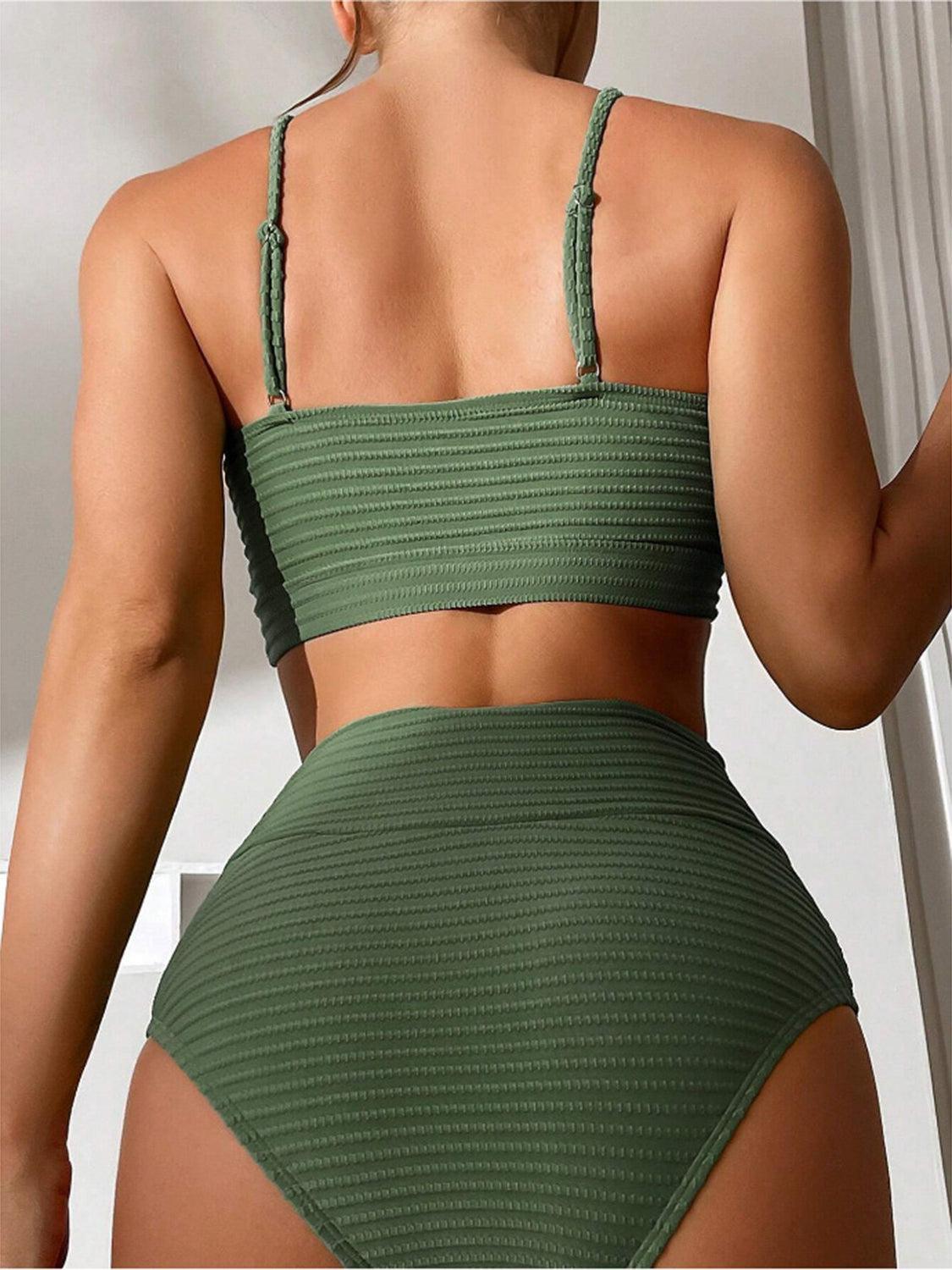 a woman in a green bikini top and bottom