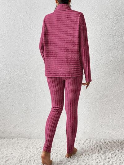 a woman in a pink sweater and pants