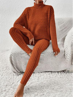 a woman sitting on top of a white couch