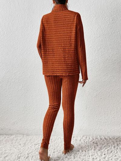 a woman in an orange sweater and leggings