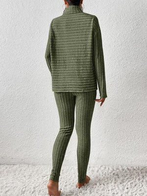 a woman in a green sweater and leggings