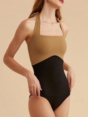 a woman in a black and tan bodysuit