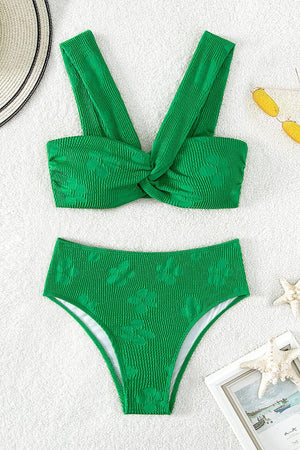 a green bikinisuit with a bow on the side