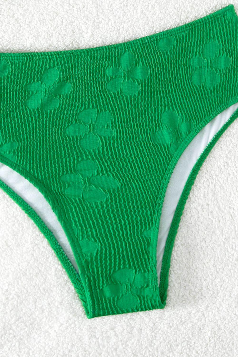 a close up of a green panties on a towel