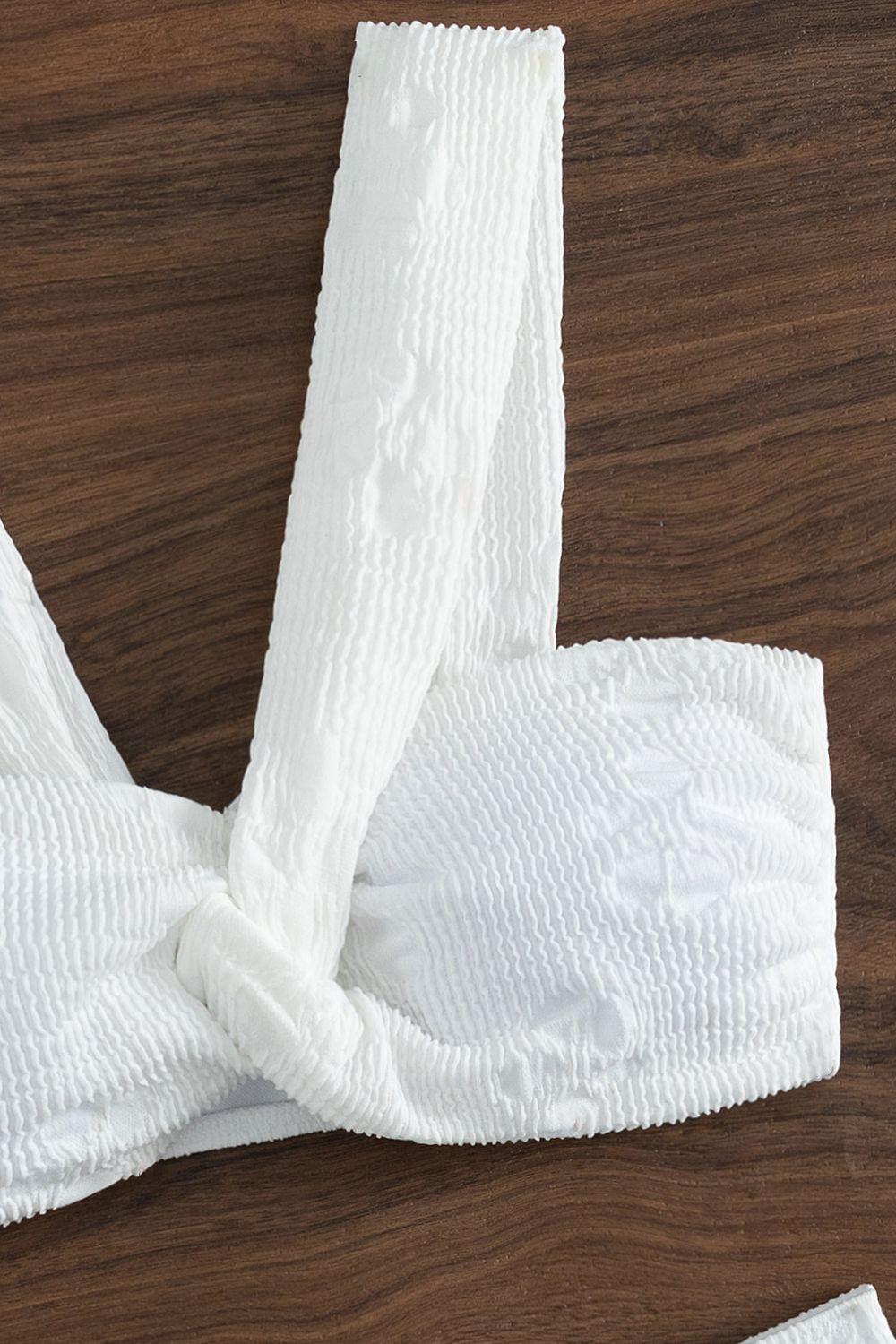 a pair of white underwear tied to a wooden table