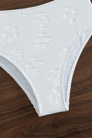 a close up of a women's underwear on a wooden surface