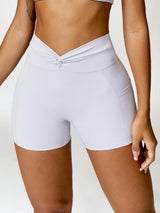 a close up of a person wearing a white shorts