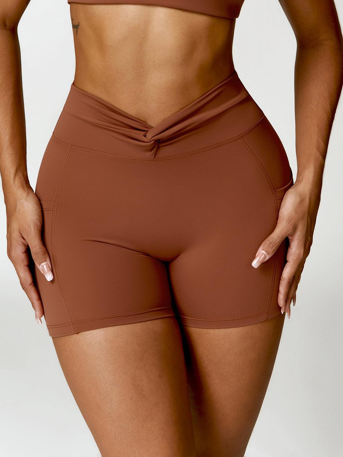 a close up of a woman's butt wearing a brown sports bra