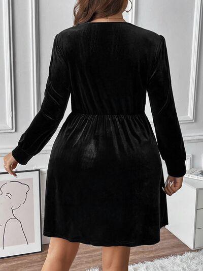 a woman wearing a black velvet dress