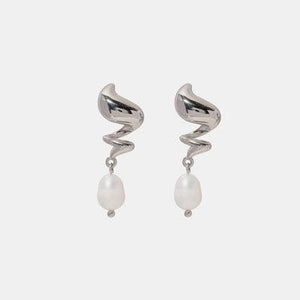 a pair of silver earrings with white pearls