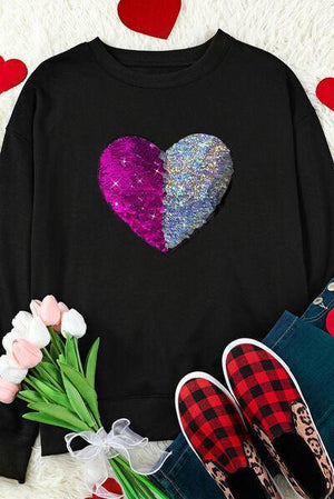 a pair of shoes and a sweater with a heart on it