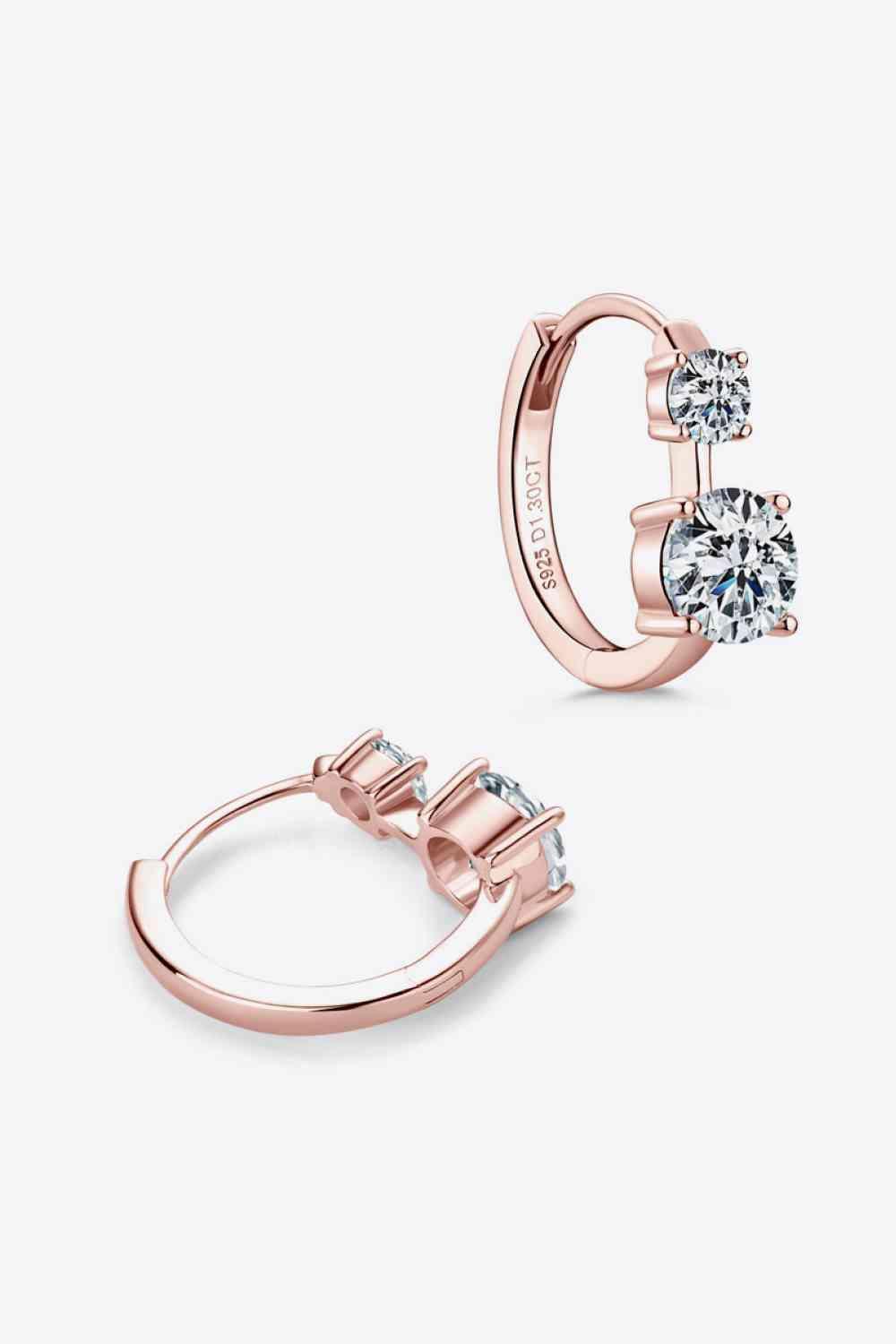 a pair of rose gold earrings with diamonds