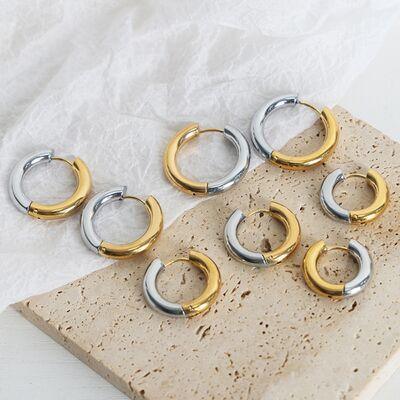 six pairs of silver and gold hoop earrings