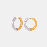 a pair of silver and gold hoop earrings