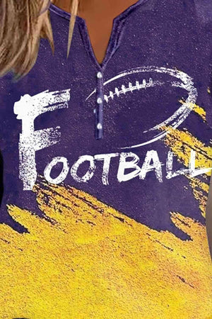 a woman wearing a purple shirt with a football painted on it