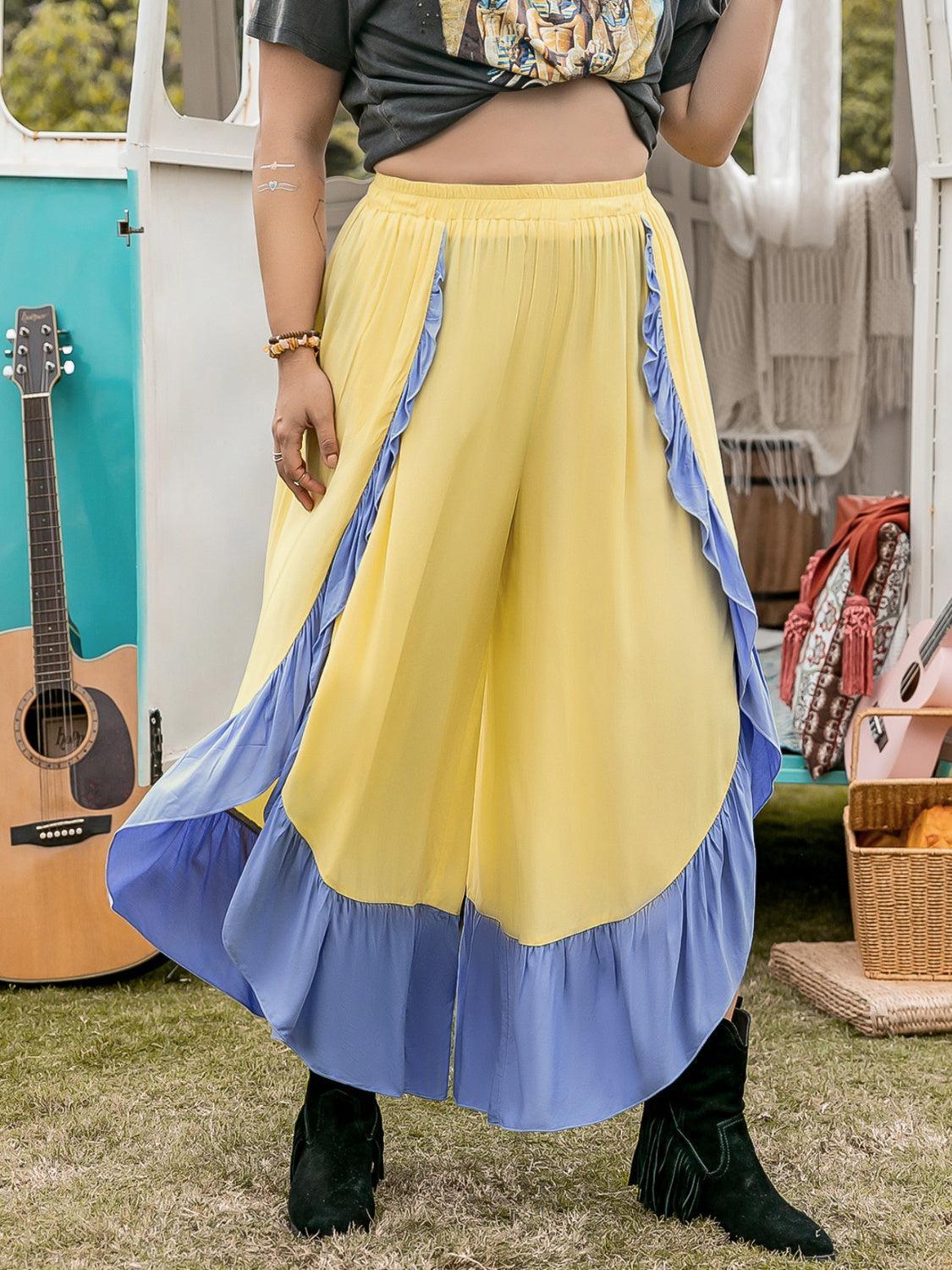 a woman in a yellow skirt and a black shirt