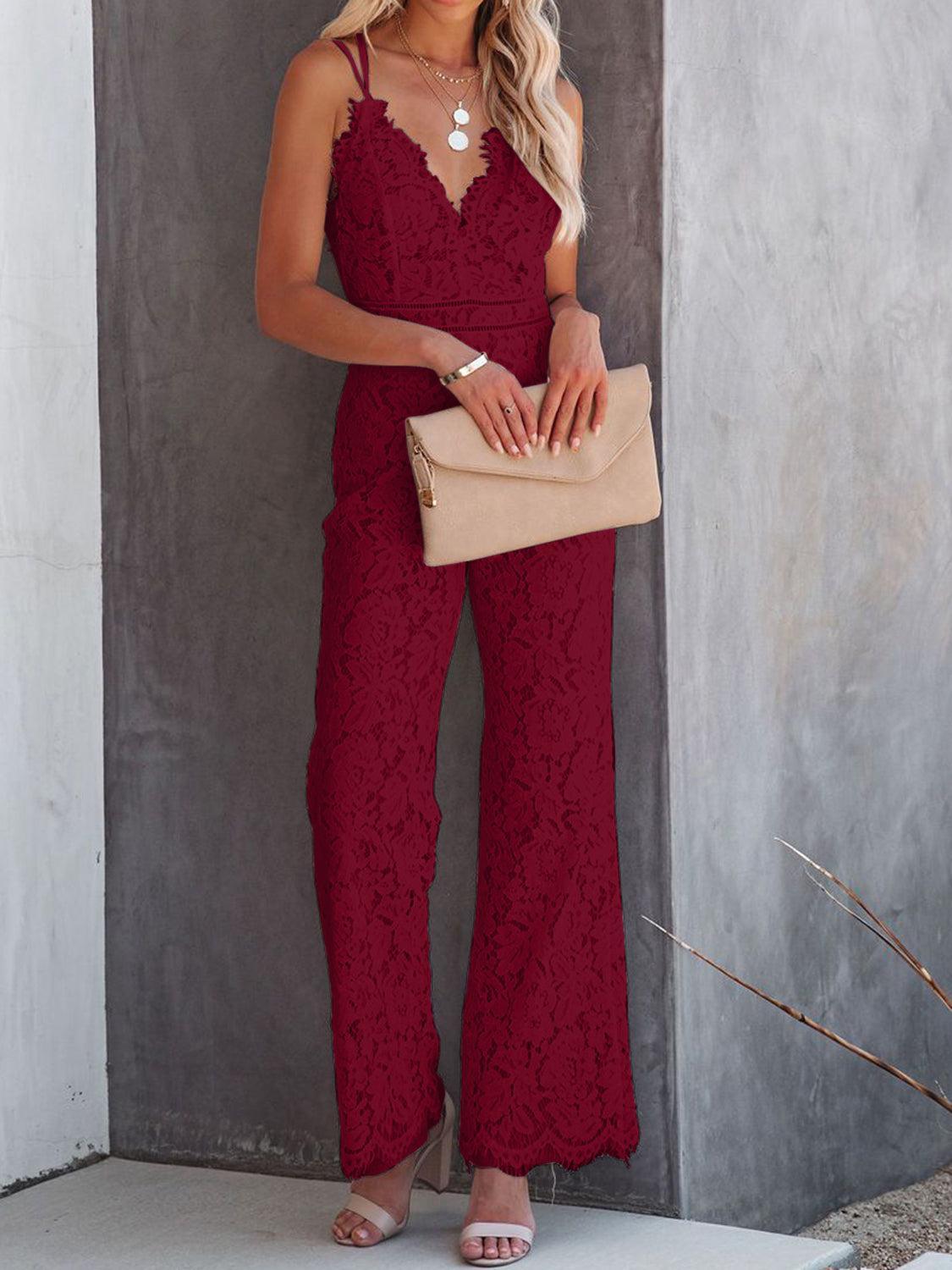 a woman wearing a red lace jumpsuit