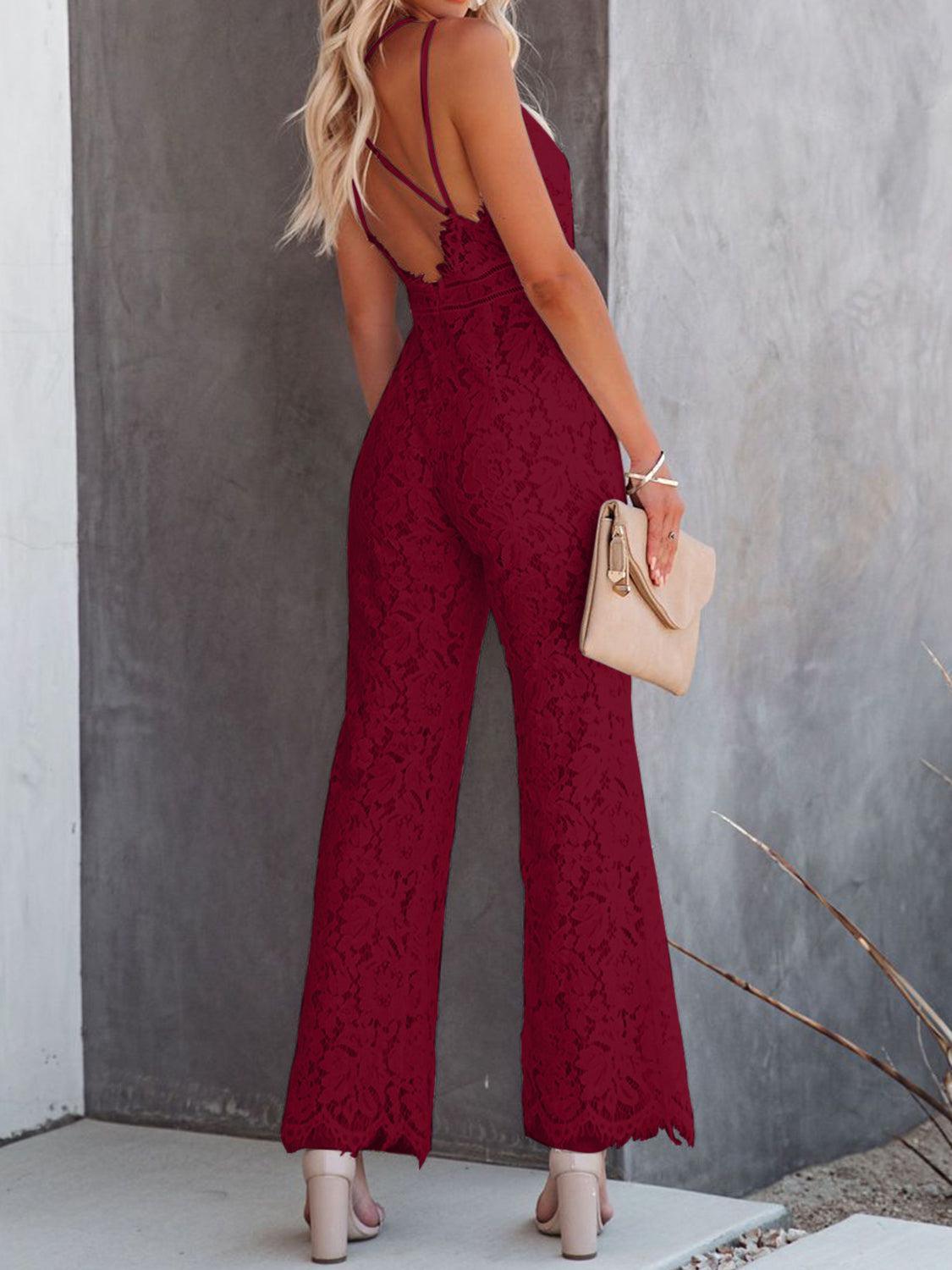 a woman in a red lace jumpsuit