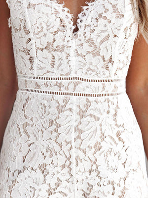 a woman wearing a white lace dress