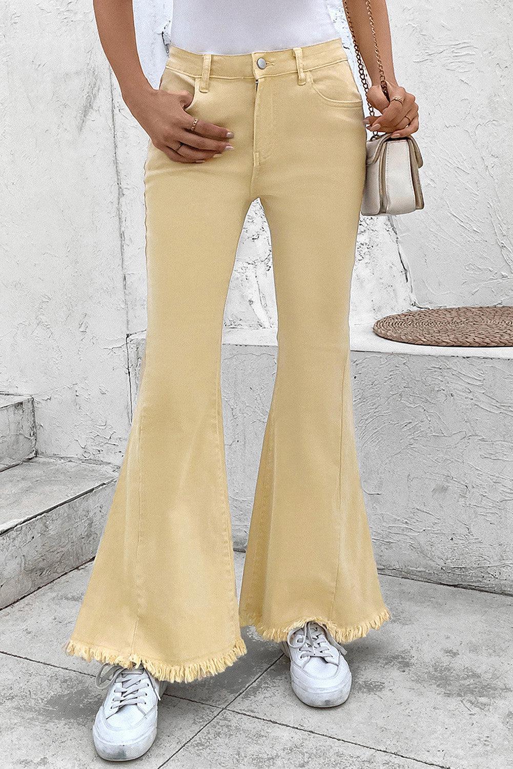 a woman in a white shirt and yellow pants