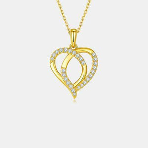 a gold necklace with two intertwined hearts