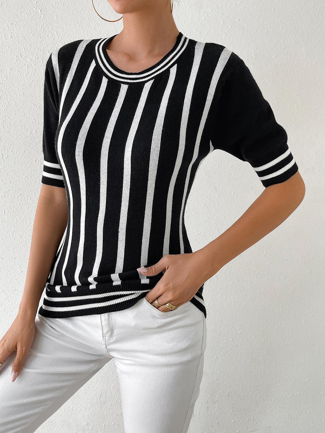 a woman wearing a black and white striped shirt