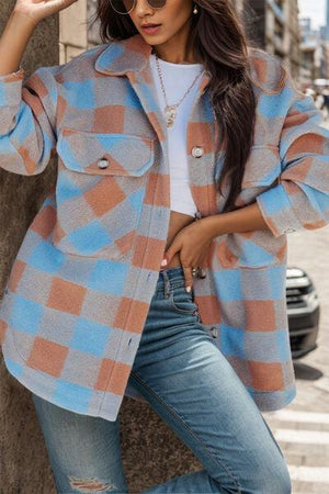 a woman leaning against a tree wearing sunglasses