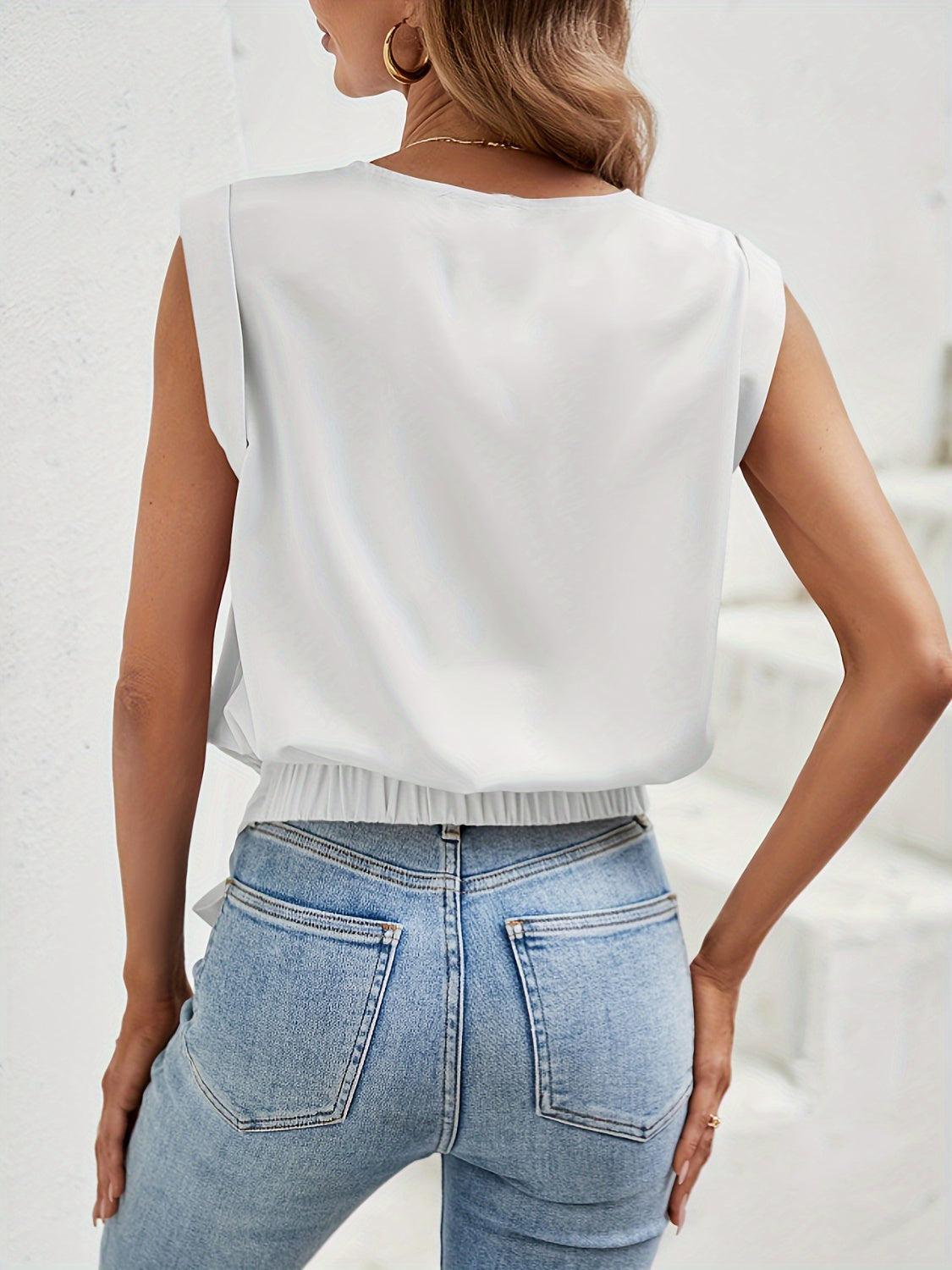 a woman wearing a white top and jeans