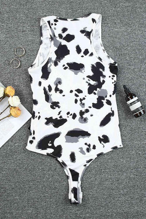 a bathing suit with a cow print on it