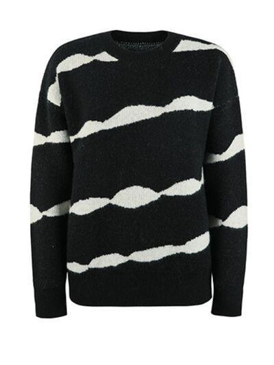 a black and white sweater with white stripes