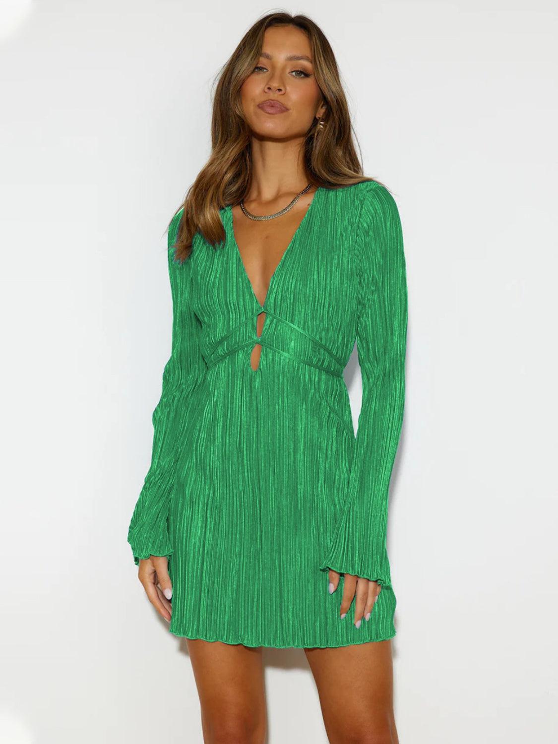 a model in a green dress