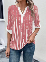 a woman wearing a red and white striped top