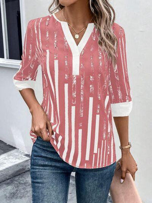 a woman wearing a red and white striped top