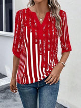 a woman wearing a red and white striped top