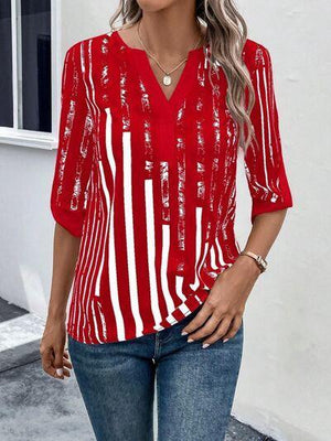 a woman wearing a red and white striped top