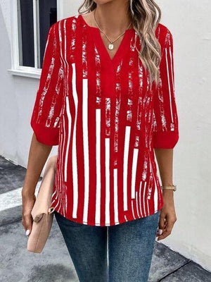 a woman wearing a red and white striped top